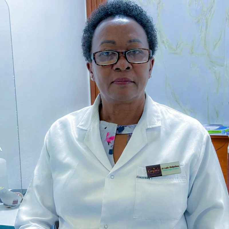 Dr. Tindyebwa Ludo, a senior Ophthalmologist Consultant, leading a surgical team during a complex eye procedure at KELH.