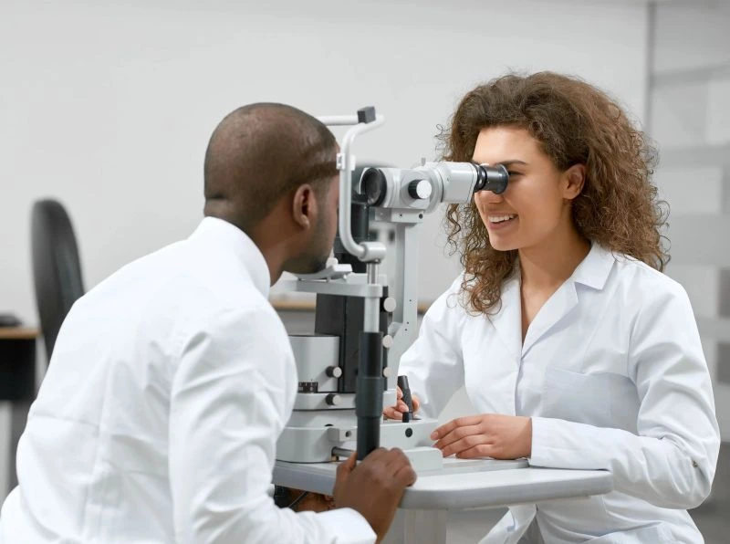 A close-up of a female patient's eye being examined with advanced diagnostic equipment at Kampala Eye & Lasik Hospital.